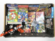 A Nintendo NES console, controllers, lead, accompanying pistol, and assorted games.