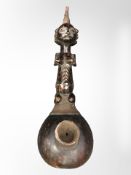 A Luba carved wooden gourd pipe with copper binding, length 47cm.