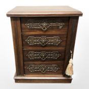 A Victorian mahogany Wellington-style miniature four drawer chest, height 44 cm,