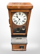 A National clocking in clock in oak case,