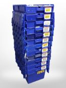 Twelve stackable plastic storage boxes with folding lids,