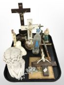 A group of crucifixes, resin bust of Christ, rosary beads and other religious ornaments.