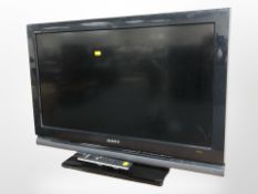 A Sony Bravia 32 inc lcd tv with lead and remote