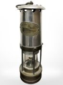 An E Thomas & Williams Limited brass and chrome miner's lamp.