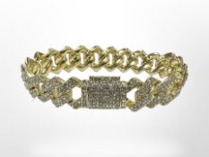 A gilded metal diamanté bracelet, length 20cm.