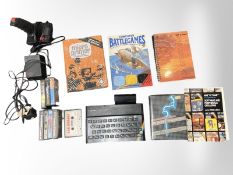 A Sinclair ZX Spectrum, together with cassette games, power lead, controller, and booklets.