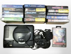A Sega Mega Drive 16-bit console, controller, lead, and a quantity of Sega Mega Drive games.