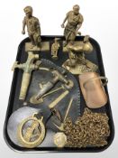 A group of brass mining figures, horse brasses, two brass taps, etc.