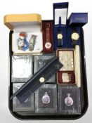 A group of contemporary pocket watches depicting locomotives,