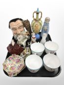 A set of four Wedgwood porcelain tea cups, various figurines, a Royal Doulton Character jug,