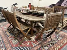 A plantation teak garden table, 90cm x 191cm,