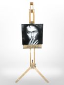 A Windsor and Newton adjustable easel with oil on canvas portrait of a man