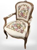 A Continental carved salon armchair in tapestry fabric