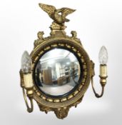 A reproduction gilt girandole mirror with twin lamp sconces,