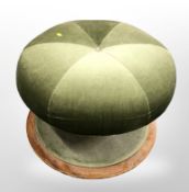 An early 20th century green dralon circular stool on mahogany support,