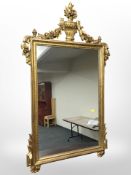 A reproduction gilt gesso over mantel mirror,