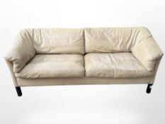 A late 20th century Scandinavian cream leather three seater settee,