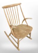 A 20th century laminated beech spindle backed rocking chair