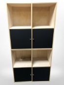 A pair of contemporary ply-wood cube shelves,