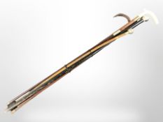 A walking cane with silver pommel, two walking sticks and three swagger sticks.