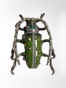 An enamel finished beetle brooch