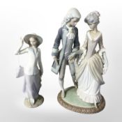 A Lladró figure of a lady and gentleman in 18th-century dress,