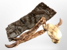 A mink fur stole, a further stole, and a hat.