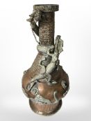 A 19th-century Tibetan copper-plated vase decorated with climbing dragons, height 40cm.