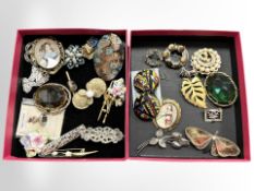 A small box of vintage brooches including a silver stag's head brooch, Danish silver floral brooch,