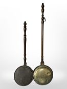 Two 19th-century bed warming pans.