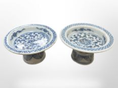 A near-pair of Chinese blue and white porcelain footed bowls, Qing, 19th century, tallest 6cm.