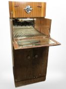 A mid 20th century burr walnut cocktail cabinet,