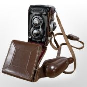 A Rolleiflex medium format TLR camera with a Tessar 5=75mm lens.