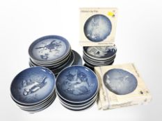 A quantity of Royal Copenhagen and Bing & Grøndahl blue and white collectors plates.