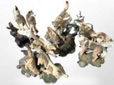 Four Danbury Mint Spirit of the Wolf sculptures, largest 25cm high.