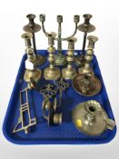 Three pairs of brass candlesticks, another candelabrum, chamber sticks, and wall sconces.