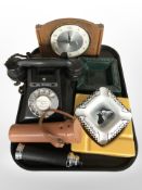 A Bakelite telephone, a Westclox mantel timepiece, three ceramic pub ash trays bearing advertising,