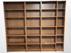 A teak-veneered four piece open bookcase,