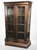 A contemporary hardwood glazed display cabinet, 132cm w x 47cm d x 190cm h.