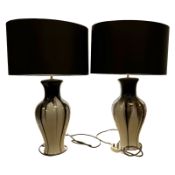 A pair of high quality glazed ceramic table lamps with shades, overall height 64cm.