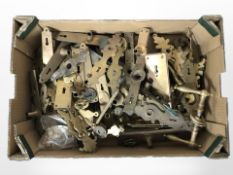 A quantity of antique brass door handles, escutcheons, and door plates.