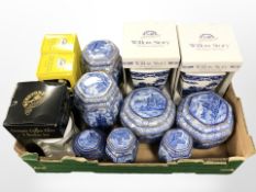 A group of Ringtons blue and white cathedral caddies, two further boxed vases, ceramic money boxes,