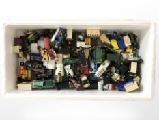 A large quantity of unboxed die-cast delivery vans, lorries, etc.