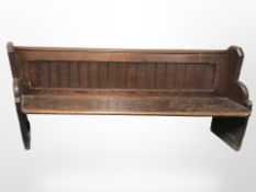 A Victorian pitch pine pew, length 209cm.
