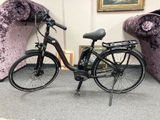 A Raleigh Motus Grand Tour electric bike, with two keys, bosch charger, instruction manual,