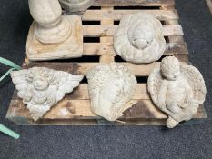 2 concrete wall pockets, a further lion mask and a figure of a cherub.