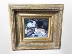 A contemporary colour print depicting rabbits outside a hutch, in ornate deep gilt frame,