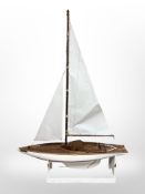 A large pond yacht, 'Bluebottle', on wooden stand, length 89cm.