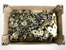 A quantity of antique brass door handles and plates and other fittings.