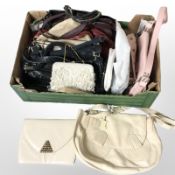 A group of lady's leather handbags and purses.